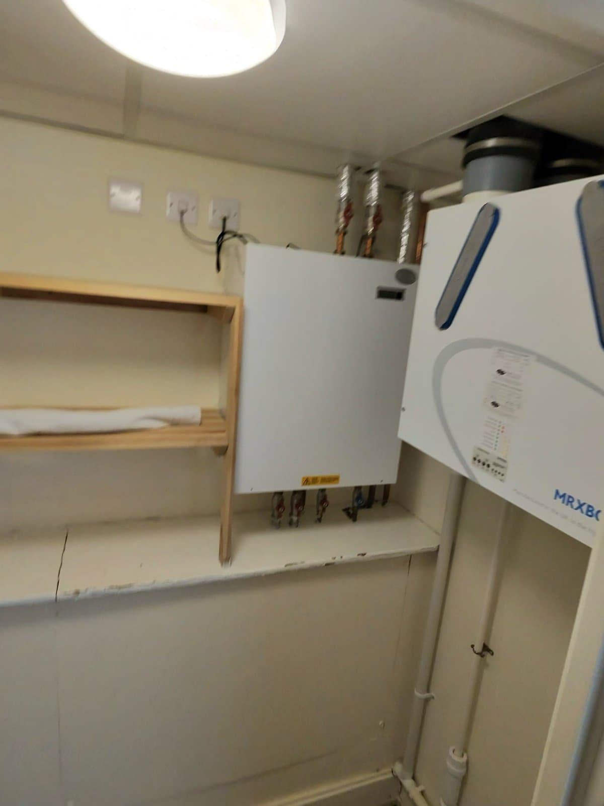 Before: The old HIU, and the new Ideal Pod 405 fitted in its place